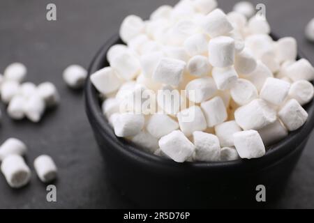 Bowl with delicious marshmallows on black background, closeup Stock Photo