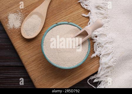 Active dry yeast on wooden table, top view Stock Photo