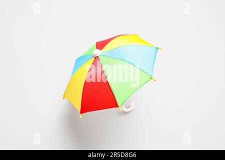 Mini colorful umbrella on white background Stock Photo