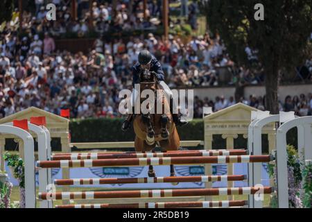 Rome, Italy - 28th May, 2023: ROME ROLEX GRAND PRIX 2023 INTERNATIONAL, Equestrian jumping, Piazza di Siena. First round, horse rider Jens Fredricson (SWE) in action on playground during competition. Stock Photo