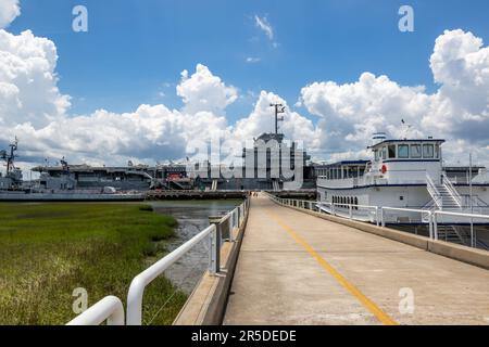 The US Navy's destroyer USS Laffey, aircraft carrier USS Yorktown and a SpiritLine Ferry are docked at Patriot's Point Naval and Maritime Museum. Stock Photo