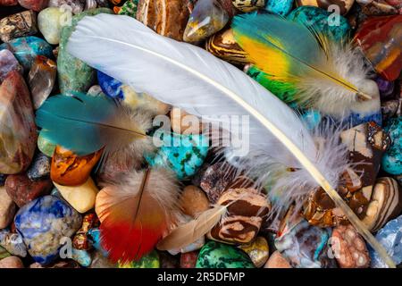 Feathers And Colorful Stones Still life Stock Photo