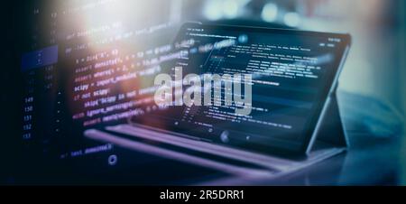 Notebook closeup photo. CSS, JavaScript and HTML usage. Monitor closeup of function source code. Abstract IT technology background. Stock Photo