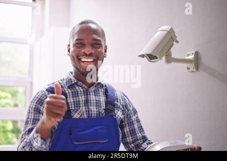 Technician Using Surveillance Security Camera Video System Stock Photo