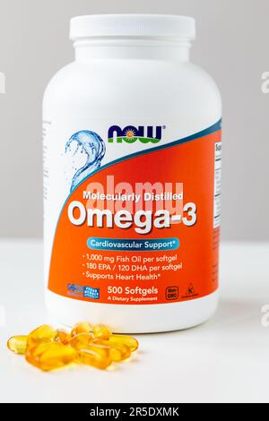 Kyiv, Ukraine - 27 January 2022: Now Foods Omega-3 natural fish oil concentrate - purified at the molecular level. Jar with of omega capsules for card Stock Photo