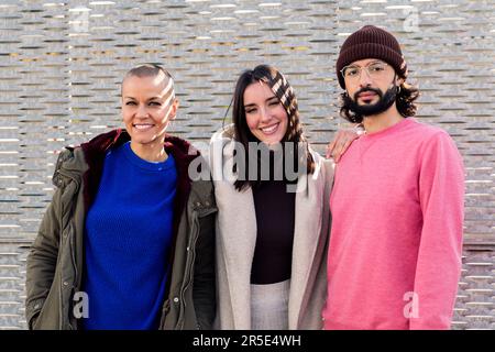 friends enjoying and smiling looking at camera Stock Photo
