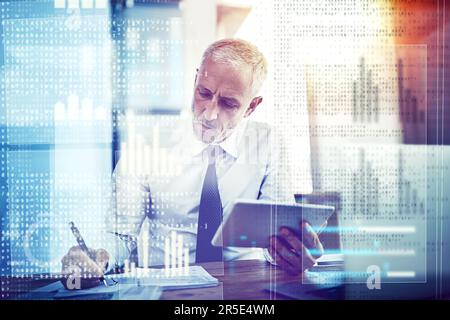 Working out the bugs in his code. a mature businessman working on programming code. Stock Photo