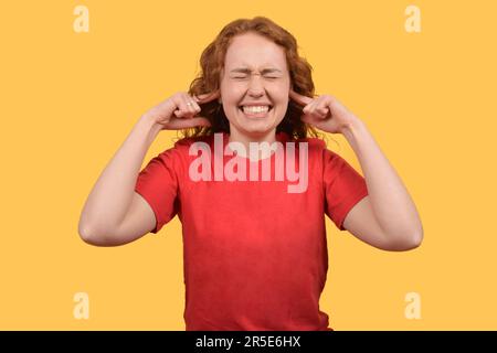 portrait of a cute curly red-haired woman Stock Photo