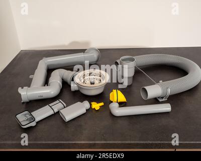 Connections for installing a kitchen sink. kitchen siphon. Stock Photo