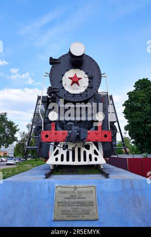 Old soviet steam locomotive on a pedestal, front view Stock Photo