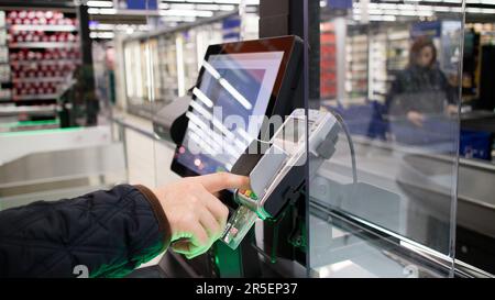 Shopper Conducting Credit Card Payment at a Supermarket Self-Checkout Stock Photo