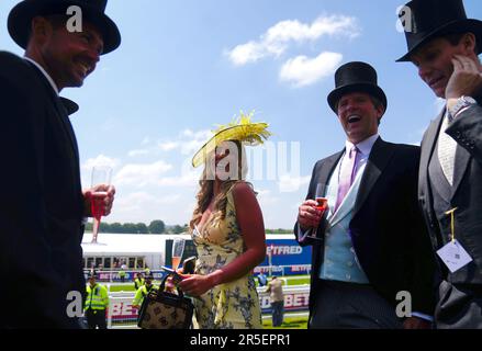 Racegoers enjoy the atmosphere during Derby Day of the 2023 Derby Festival at Epsom Downs Racecourse, Epsom. Picture date: Saturday June 3, 2023. Stock Photo