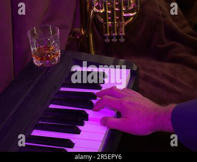 Piano playing at the jazz club Stock Photo