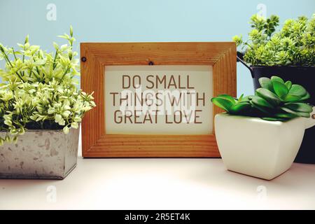 "Do Small Things With Great Love" Inspirational and motivational quote written on paper card Stock Photo