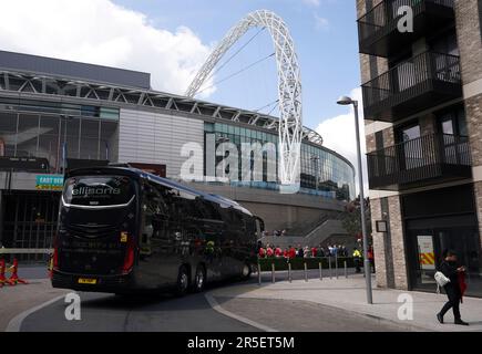 Coaches drive in to the green car park ahead of the Emirates FA Cup final at Wembley Stadium, London. Picture date: Saturday June 3, 2023. Stock Photo