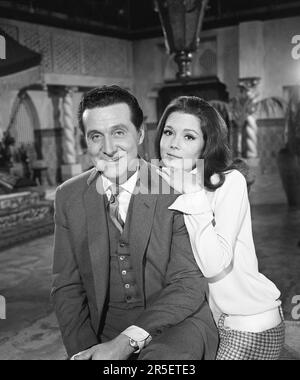 PATRICK MACNEE and DIANA RIGG on set candid portrait circa 1966 during filming of Colour Test for American Prologue for TV Series THE AVENGERS creator Sydney Newman ABC Weekend Television / Associated British Corporation Stock Photo