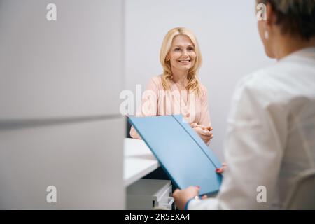 Nice lady visits a gynecologist in a cosmetology center Stock Photo