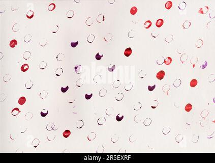 Red and purple watercolor paint pattern stamped repeatedly on white paper, abstract simple background. Uneven colorful circles scattered chaotically, Stock Photo