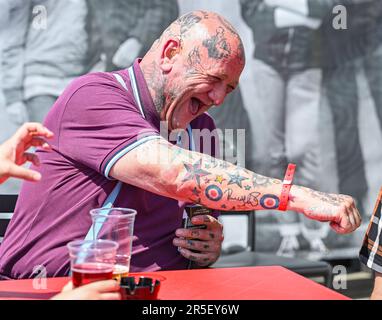 Brighton UK 3rd June 2023 - Skinheads enjoy the sunshine at the annual Great Skinhead Reunion weekend in Brighton where they gather from around the World to enjoy their music and fashion: Credit Simon Dack / Alamy Live News Stock Photo