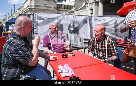 Brighton UK 3rd June 2023 - Skinheads enjoy the sunshine at the annual Great Skinhead Reunion weekend in Brighton where they gather from around the World to enjoy their music and fashion: Credit Simon Dack / Alamy Live News Stock Photo