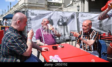 Brighton UK 3rd June 2023 - Skinheads enjoy the sunshine at the annual Great Skinhead Reunion weekend in Brighton where they gather from around the World to enjoy their music and fashion: Credit Simon Dack / Alamy Live News Stock Photo