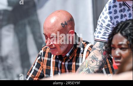 Brighton UK 3rd June 2023 - Skinheads enjoy the sunshine at the annual Great Skinhead Reunion weekend in Brighton where they gather from around the World to enjoy their music and fashion: Credit Simon Dack / Alamy Live News Stock Photo