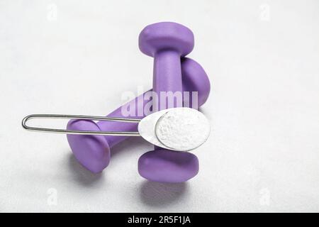 AAKG supplement. Man holding a scoop of AAKG powder in his hand. Close up  Stock Photo - Alamy