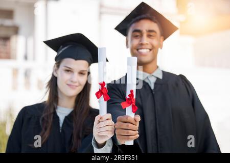 Graduation portrait, diploma and couple of friends in college, education success and achievement or scholarship. Award, certificate and graduate Stock Photo