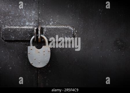 Old rusty lock on metal doors. Lock on the door with an empty place for an inscription Stock Photo