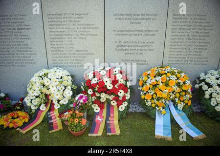 Eschede, Germany. 03rd June, 2023. Wreaths of flowers lie in front of the memorial plaque of the victims of the ICE accident in Eschede on the 25th anniversary. On June 03, 1998, after a wheel tire broke in Eschede, Lower Saxony, several carriages of an ICE train crashed into a road bridge at a speed of 200. 101 people died. Credit: Gregor Fischer/dpa/Alamy Live News Stock Photo