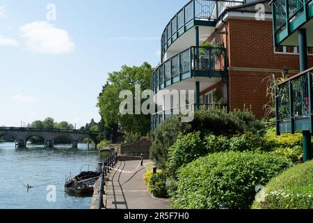 Maidenhead, UK. 3rd June, 2023. Two boats have been destroyed by fire in two separate incidents this week during the early hours of 31st May and 2nd June along the River Thames in Maidenhead, Berkshire. One of the charred wrecks remains cordoned off (pictured) and is now moored outside the riverside Chandlers Quay flats where there is a strong smell of fuel. The other boat that was destroyed by fire near to Boulter's Lock has, according to local residents, now sunk. Fortunately nobody was injured in the two fires. Thames Valley Police are reported to be making further investigations into alleg Stock Photo