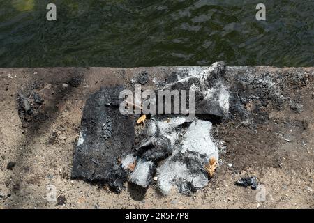 Maidenhead, UK. 3rd June, 2023. Two boats have been destroyed by fire in two separate incidents this week during the early hours of 31st May and 2nd June along the River Thames in Maidenhead, Berkshire. One of the charred wrecks remains cordoned off and is now moored outside the riverside Chandlers Quay flats where there is a strong smell of fuel. The other boat that was destroyed by fire near to Boulter's Lock has, according to local residents, now sunk (pictured). Fortunately nobody was injured in the two fires. Thames Valley Police are reported to be making further investigations into alleg Stock Photo