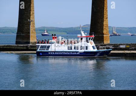 South Queensferry, Scotland, UK. 3rd Jun 2023.  A hive of activity at South Queensferry with visitors enjoying the fine sunny weather and participating in various watersport activities and boat trips. Maid of the Forth boat tours with passengers on board just about to set off for a trip around the estuary and bridges. Credit: Craig Brown/Alamy Live News Stock Photo