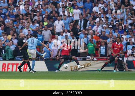 Manchester City's Ilkay Gundogan (2nd left) scores his and his side's second goal of the game during the Emirates FA Cup final at Wembley Stadium, London. Picture date: Saturday June 3, 2023. Stock Photo