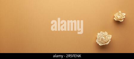 Autumn composition with dried white roses on light brown background. Flat lay copy space. Stock Photo