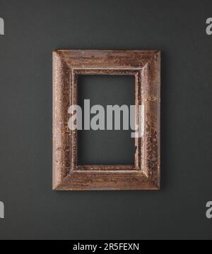 Minimal composition with vintage frame on dark background.  Flat lay, copy space. Stock Photo