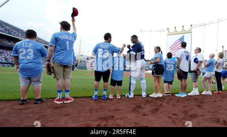 Members of the Colorado Rockies team stand at attention for the American  national anthem at a spring training major league baseball game at Salt  River Fields stadium in Scottsdale, Arizona - LOC's