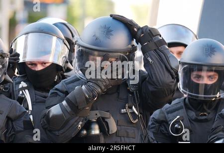 Leipzig, Germany. 03rd June, 2023. Police officers prepare for an operation. A left-wing demonstration on the occasion of the sentencing of left-wing extremists was banned. Police officers stand during protests against the verdict in the trial of Lina E. in Leipzig. The Dresden Higher Regional Court had sentenced the student Lina E. to five years and three months imprisonment. For a long time, the left-wing scene has been mobilizing for the so-called 'Day X'. Credit: Sebastian Willnow/dpa/Alamy Live News Stock Photo