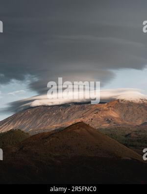 Spectacular lenticular clouds over the Teide volcano at sunset on the Canary Island of Tenerife. Stock Photo