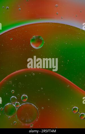 OIil on water with coloured background. Stock Photo