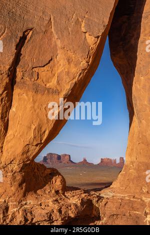 Sunset Image through Teardrop Arch at Monument Valley Navajo Tribal Park, Arizona, United States Stock Photo