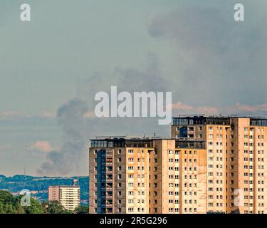 Glasgow, Scotland, UK 3rd June, 2023. Firefighters are tackling the blaze near Calderside Road, between Blantyre and East Kilbride. Big fire in south east  of the town over the hills about 20 miles away viewed from the west end of the city over the lincoln road towers. Credit Gerard Ferry/Alamy Live News Stock Photo