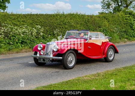 1955 50s fifties Red MG Midget Classic vintage car, Yesteryear motors en route to Capesthorne Hall Vintage Collectors car show, Cheshire, UK 2023 Stock Photo