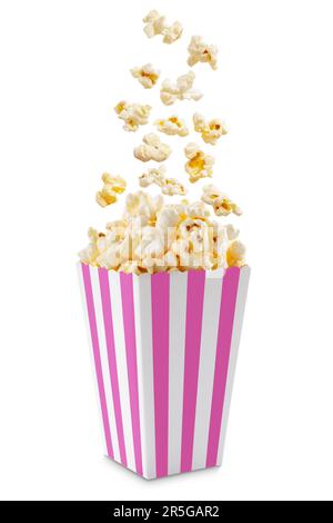 Popcorn flying out of pink white striped paper box isolated on white background with copy space. Splash, levitation of popcorn grains. Stock Photo