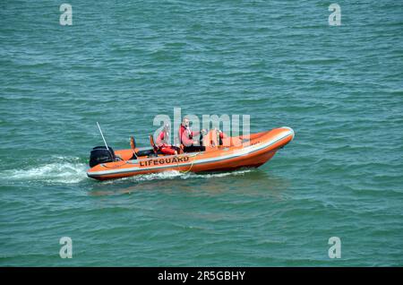 Brighton, UK, 03 June 2023  Sunshine on Brighton beach.  Lifeguard boat patrols the beach. Credit: JOHNNY ARMSTEAD/Alamy Live News Stock Photo