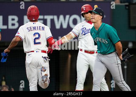 Texas Rangers' Corey Seager (5) and Marcus Semien, right, celebrate their  7-0 win in a baseball game against the Philadelphia Phillies, Tuesday, June  21, 2022, in Arlington, Texas. (AP Photo/Tony Gutierrez Stock Photo - Alamy