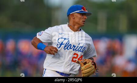 Florida infielder Josh Rivera (24) warms up before an NCAA