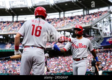 Philadelphia Phillies' Edmundo Sosa gestures from second base after hitting  a double win the sixth inning of a baseball game against the Cleveland  Guardians, Saturday, July 22, 2023, in Cleveland. (AP Photo/Sue