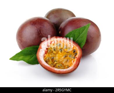 Fresh passion fruit with green leaves isolated on a white background Stock Photo