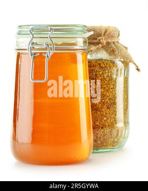 Jar with bee pollen and jar with honey isolated on white. Nutritional supplements Stock Photo